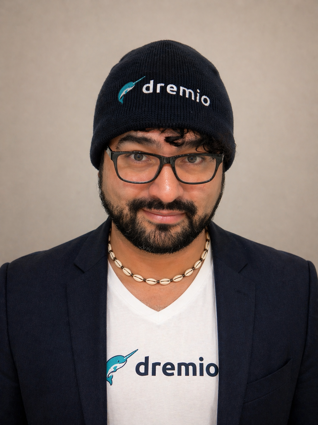 Alex Merced — professional headshot, Dremio tee and blazer